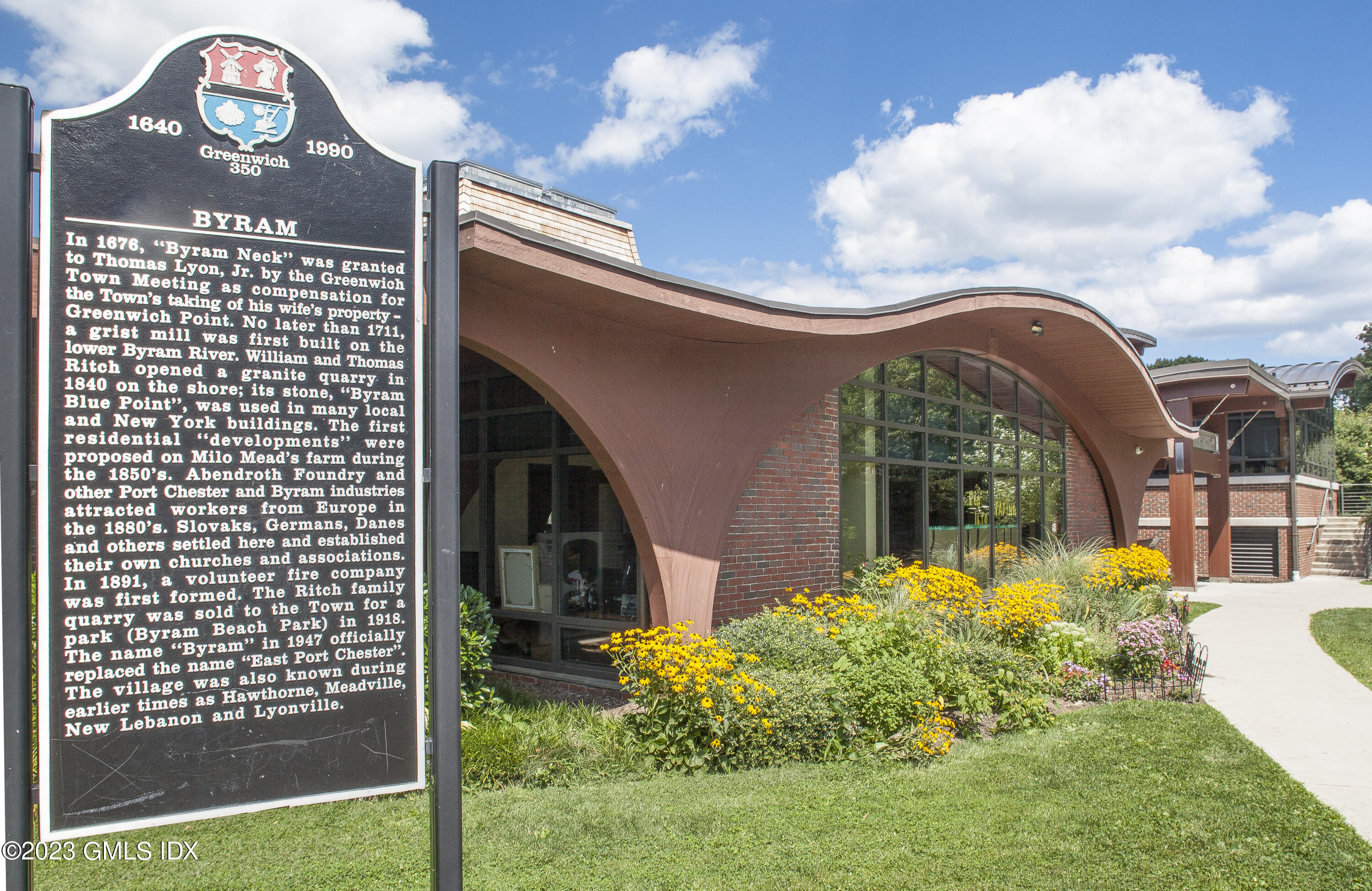 180 Byram Shore Road Greenwich, CT 06830 - Photo 26 of 29 a view of a house with a small yard and potted plants