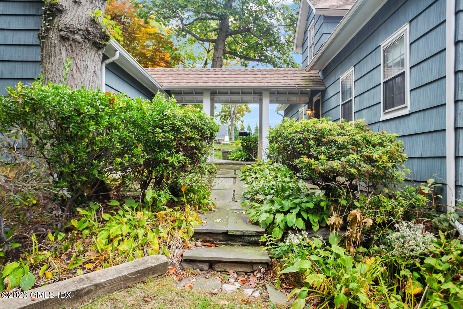 180 Byram Shore Road Greenwich, CT 06830 - Photo 5 of 29 a front view of a house with a yard
