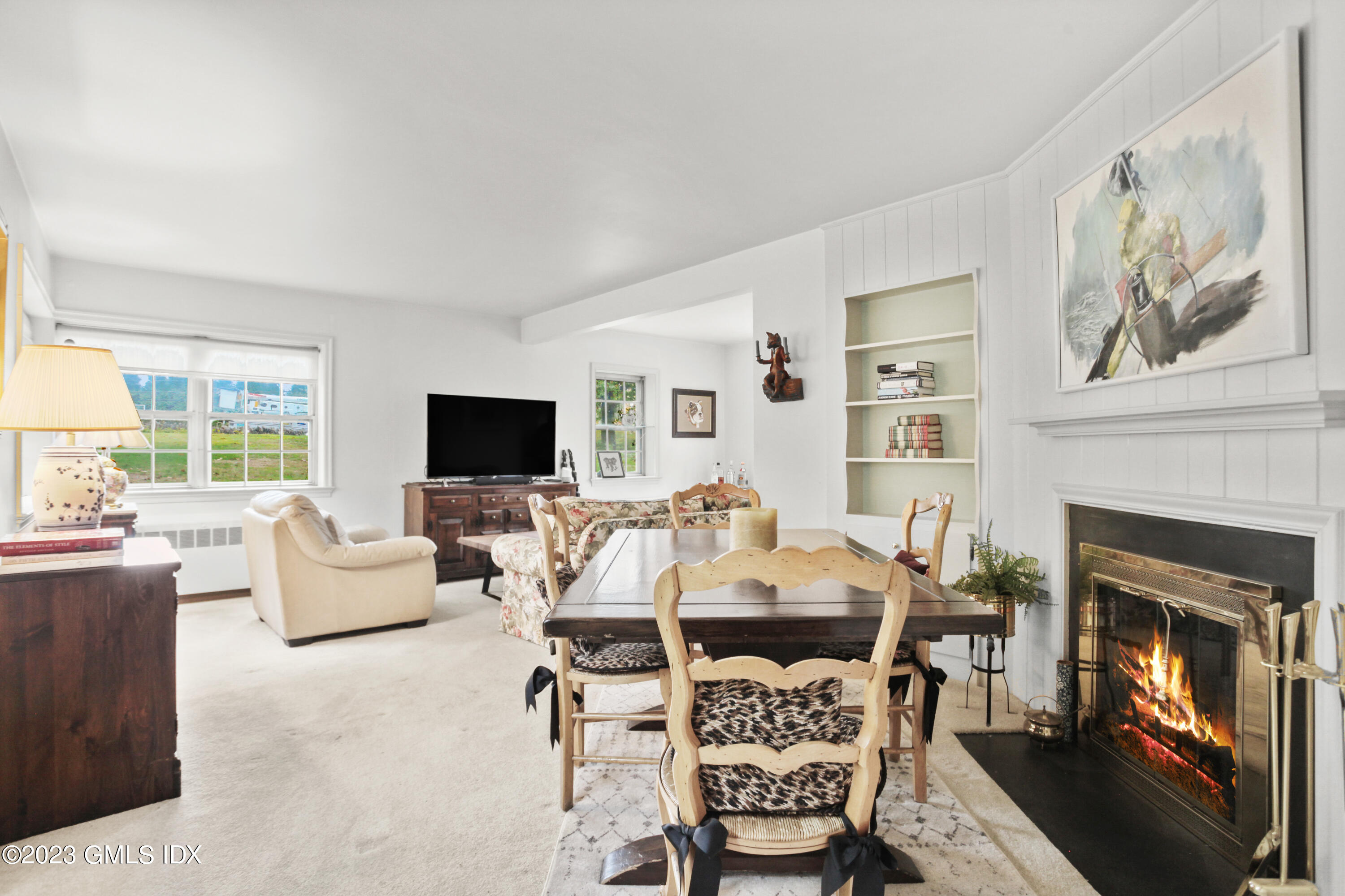 180 Byram Shore Road Greenwich, CT 06830 - Photo 9 of 29 a living room with furniture fireplace and a large window