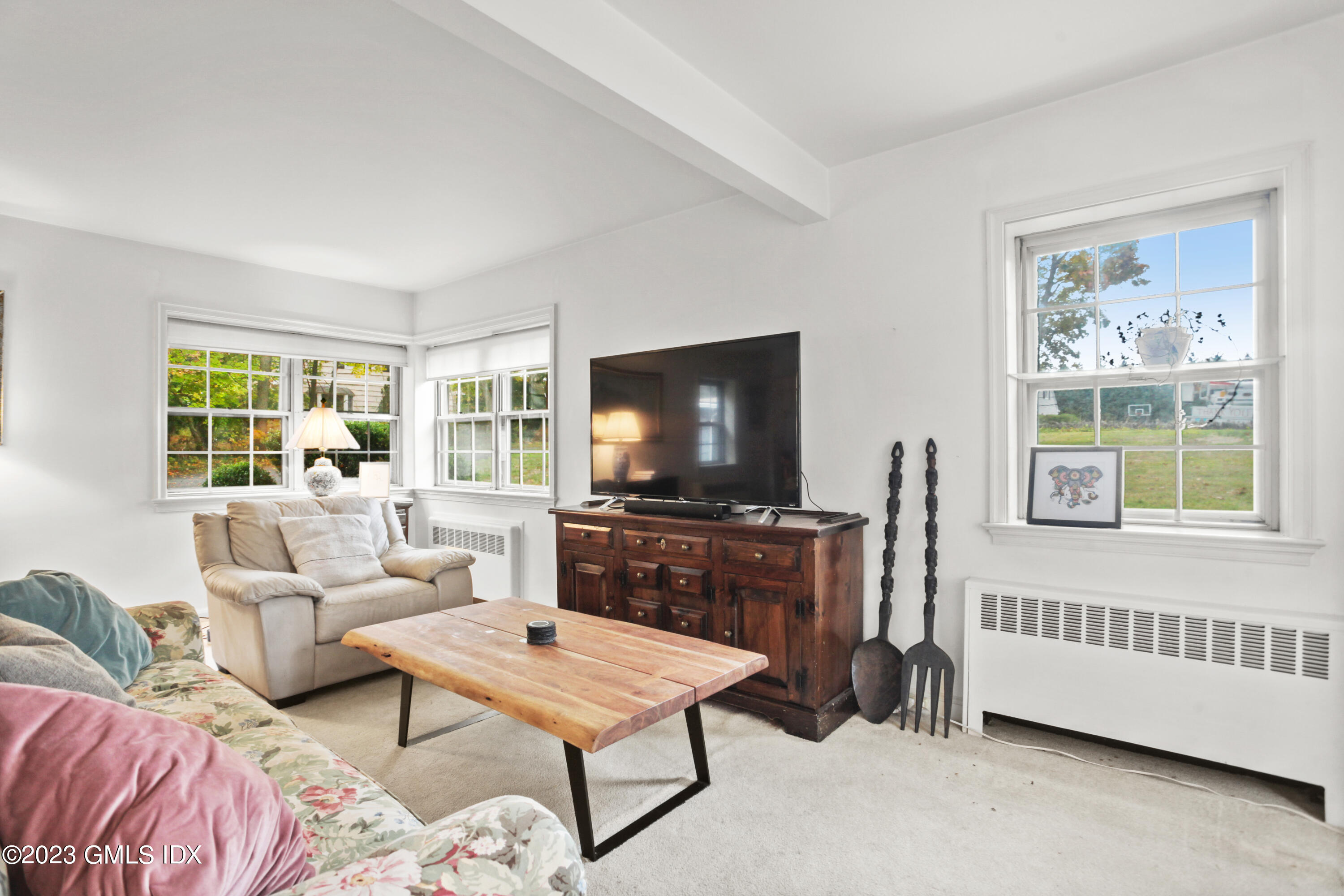 180 Byram Shore Road Greenwich, CT 06830 - Photo 10 of 29 a living room with furniture and a flat screen tv
