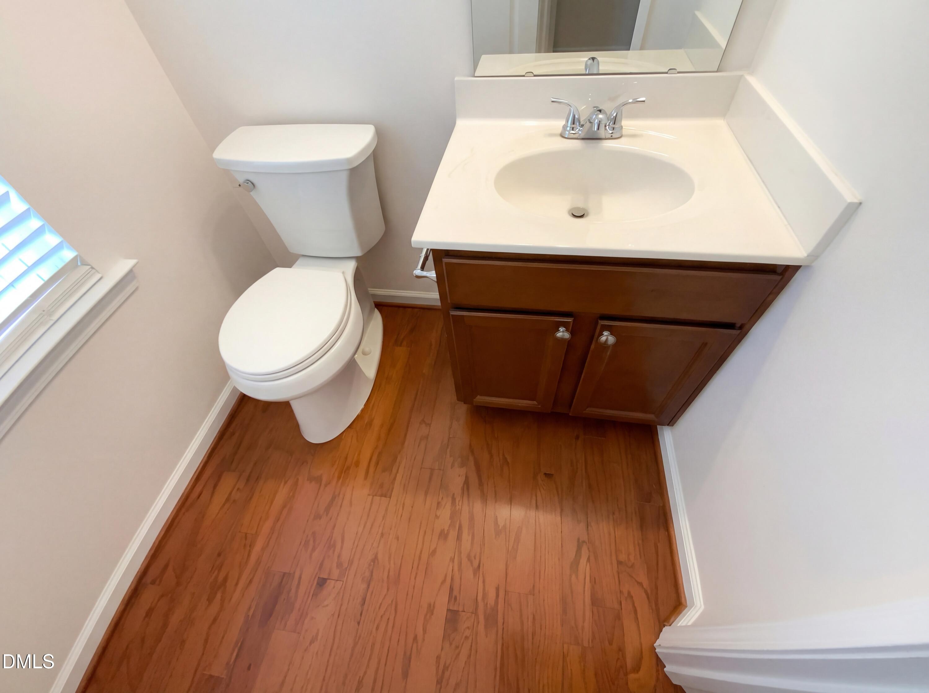 1661 Holly Grove Way Durham, NC 27713 - Photo 11 of 19 a bathroom with a sink and a toilet