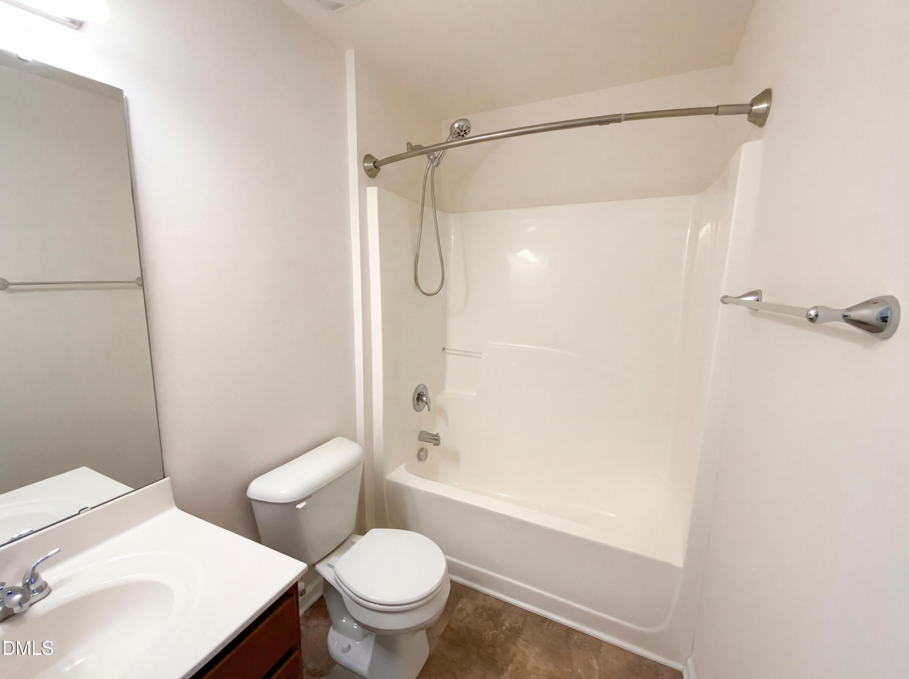 1661 Holly Grove Way Durham, NC 27713 - Photo 13 of 19 a white toilet sitting next to a bath tub