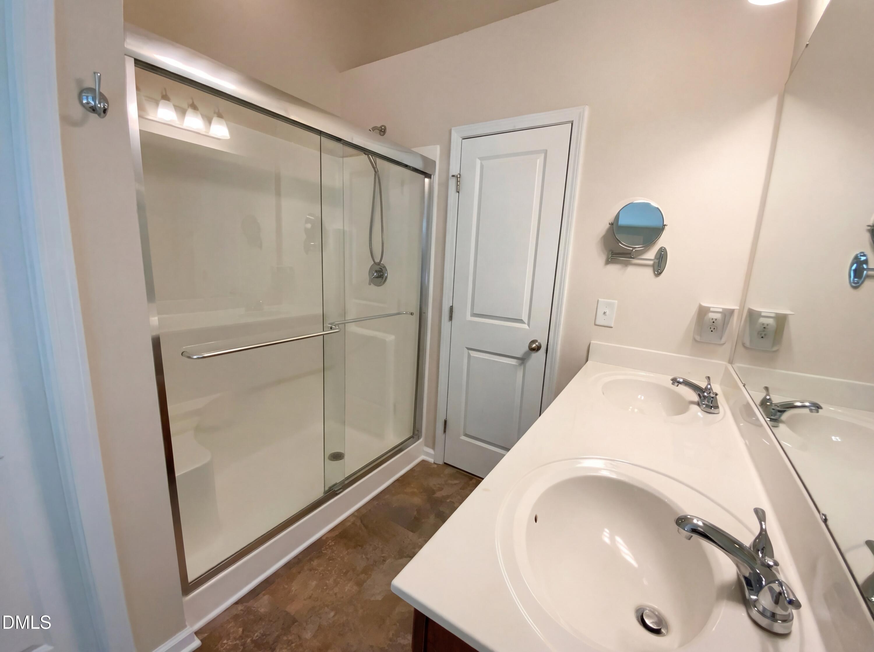 1661 Holly Grove Way Durham, NC 27713 - Photo 16 of 19 a bathroom with a sink and a mirror