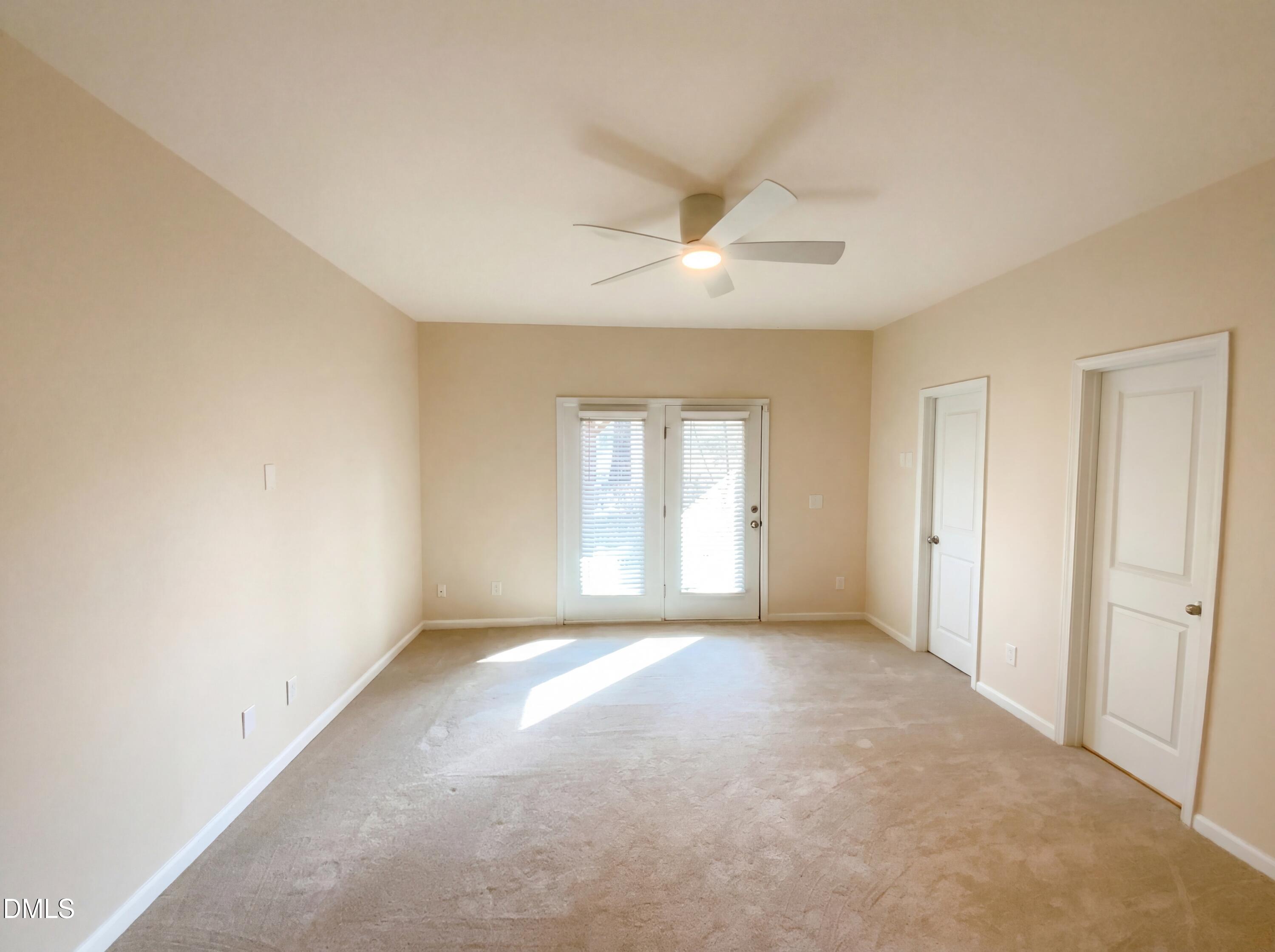 1661 Holly Grove Way Durham, NC 27713 - Photo 4 of 19 a view of a big room with windows and chandelier fan