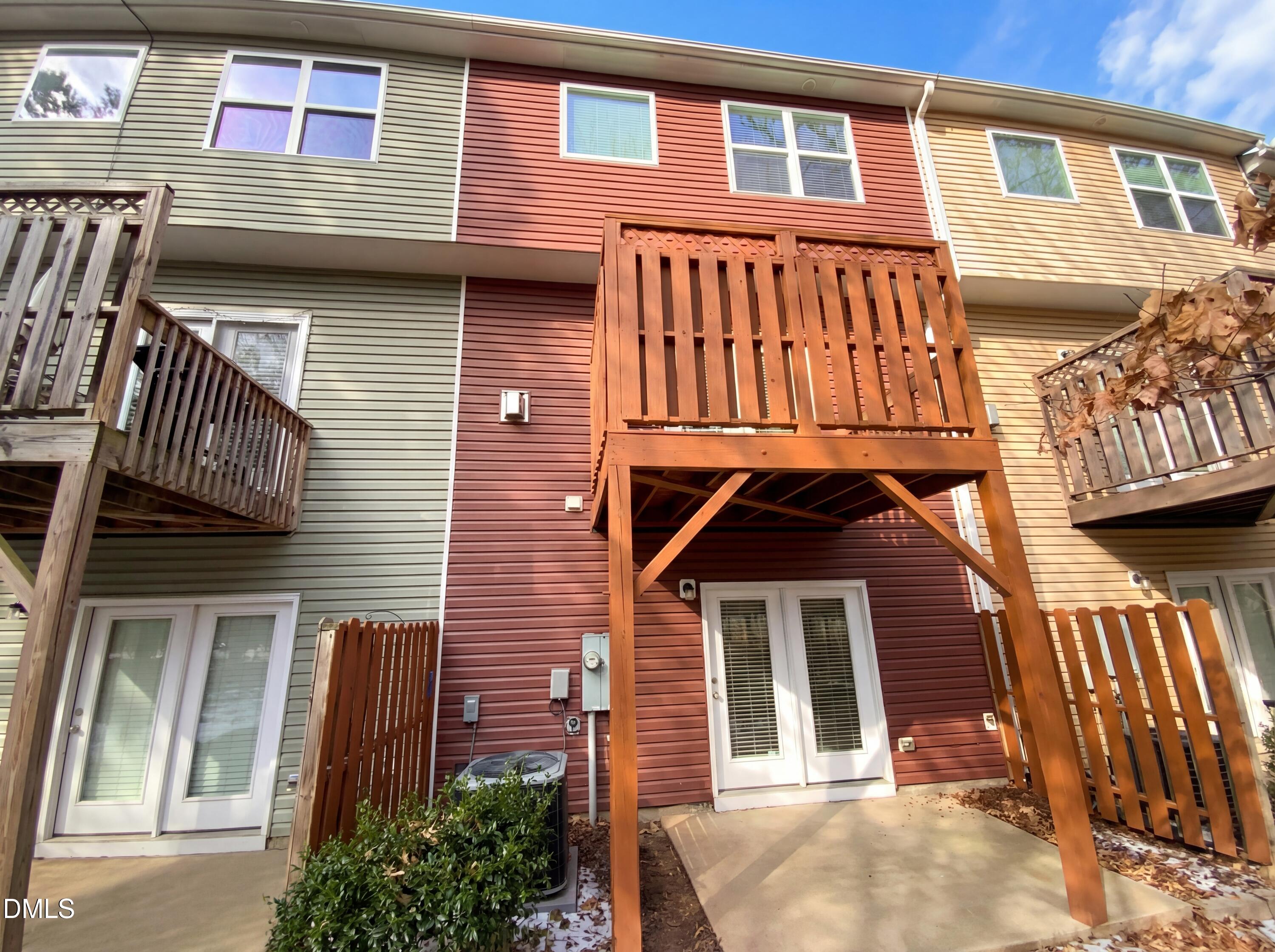 1661 Holly Grove Way Durham, NC 27713 - Photo 5 of 19 a front view of a house with a balcony