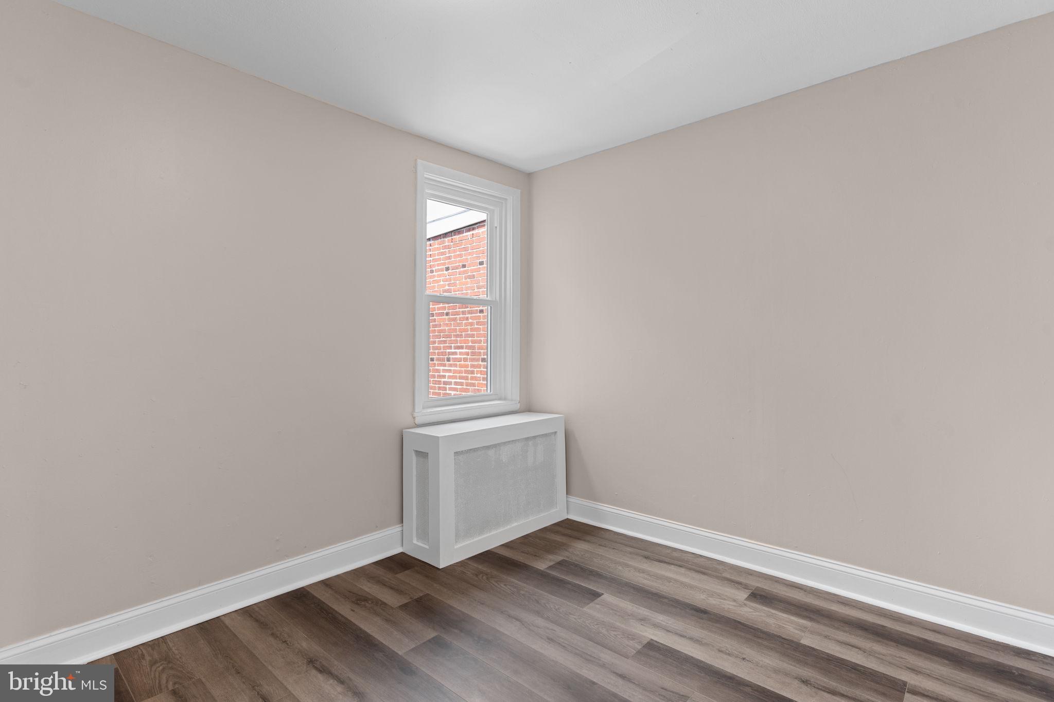 7122 Gillespie Street Philadelphia, PA 19135 - Photo 12 of 24 a view of an empty room and window