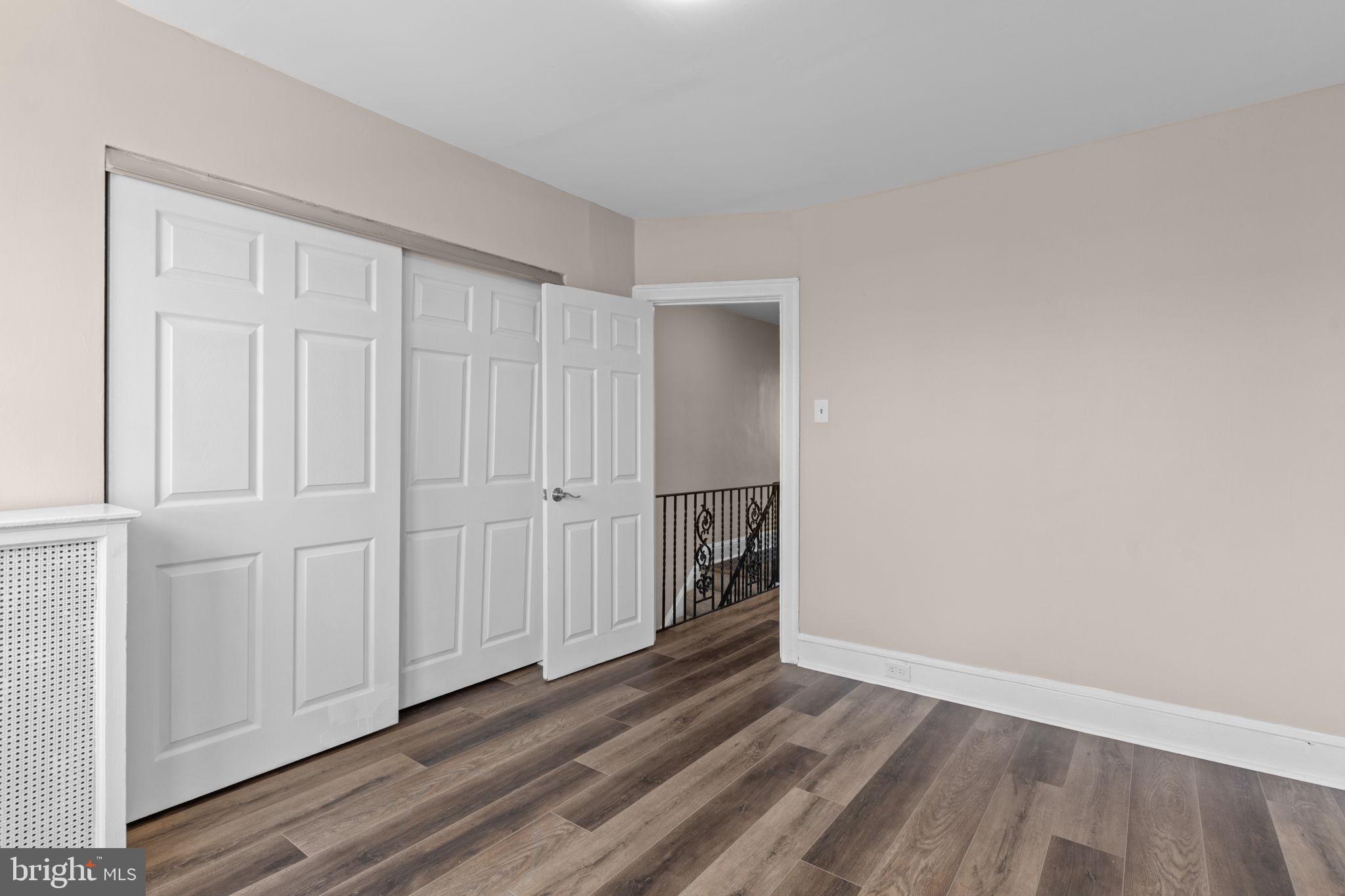 7122 Gillespie Street Philadelphia, PA 19135 - Photo 15 of 24 a view of a livingroom with an empty space and wooden floor