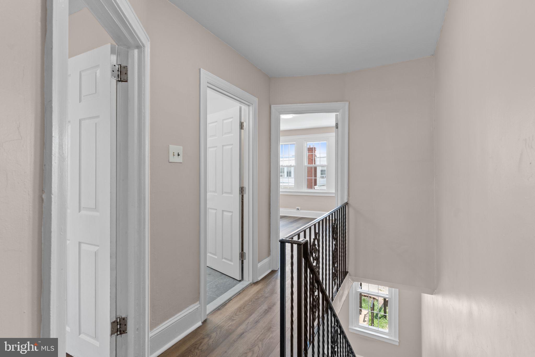 7122 Gillespie Street Philadelphia, PA 19135 - Photo 17 of 24 a view of entryway with stairs and wooden floor