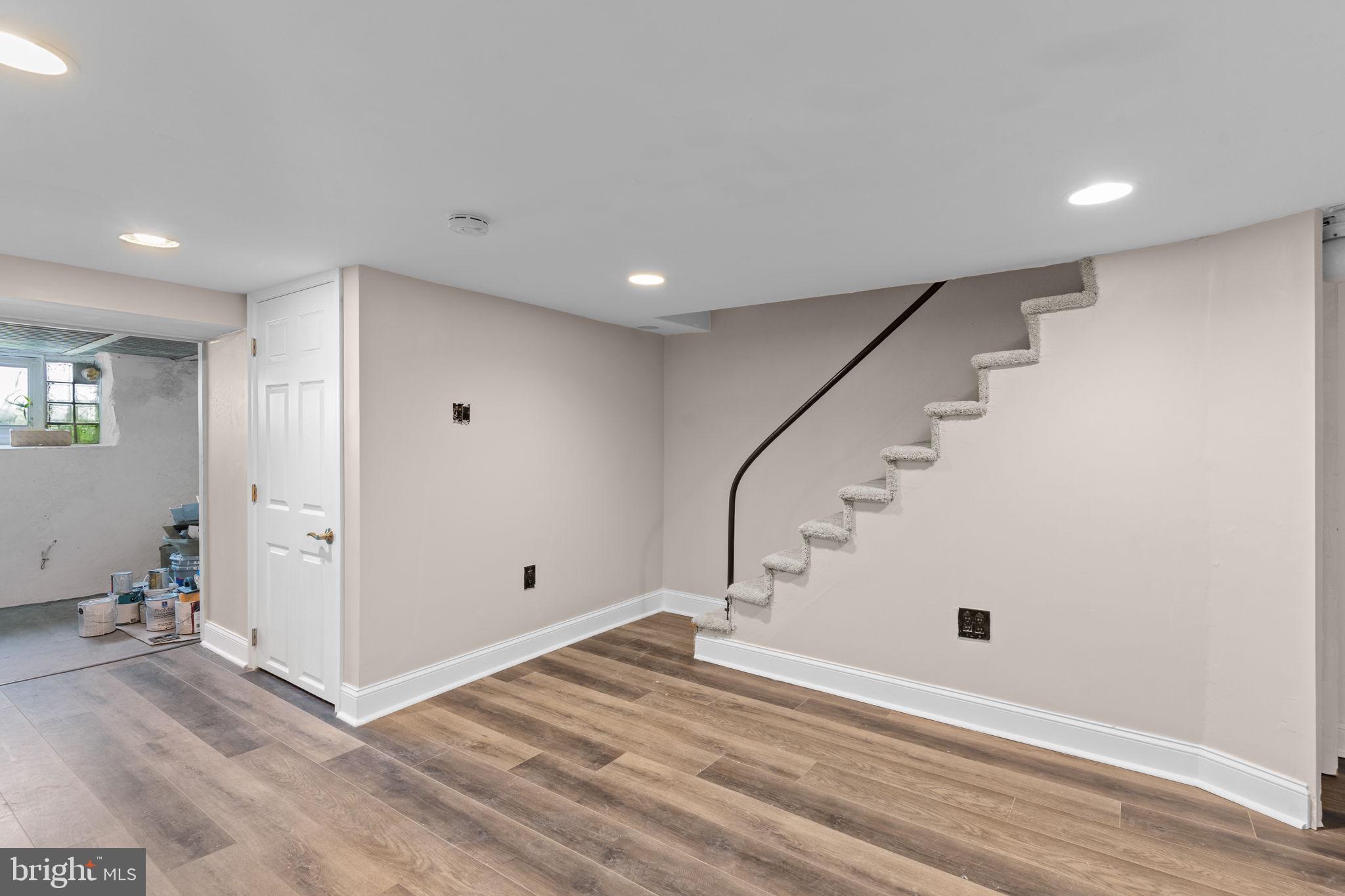 7122 Gillespie Street Philadelphia, PA 19135 - Photo 19 of 24 a view of entryway with wooden floor and stairs