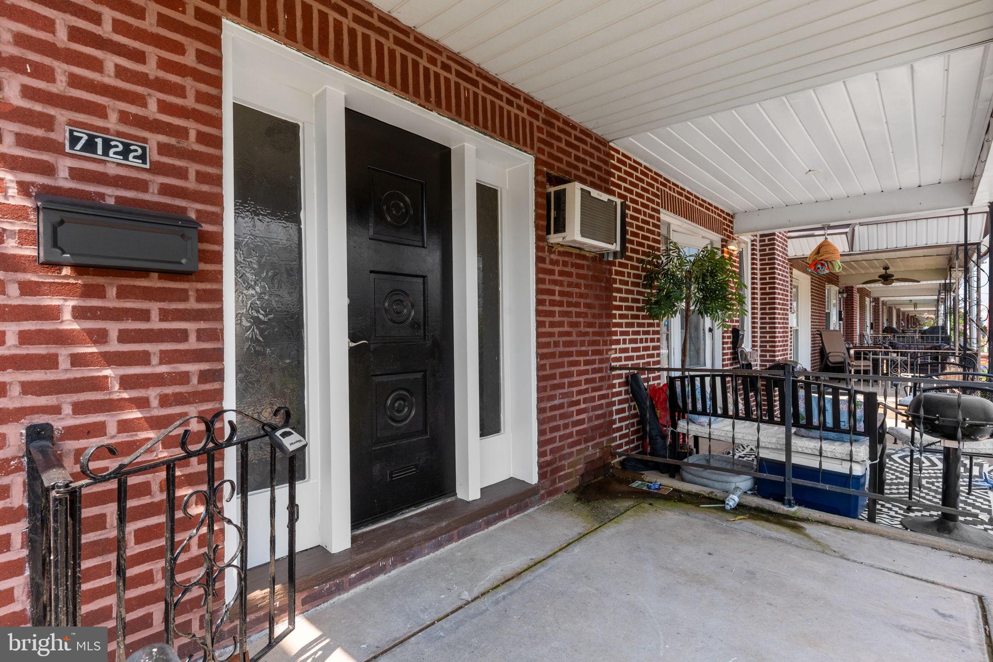7122 Gillespie Street Philadelphia, PA 19135 - Photo 2 of 24 a view of a porch with a door and a porch