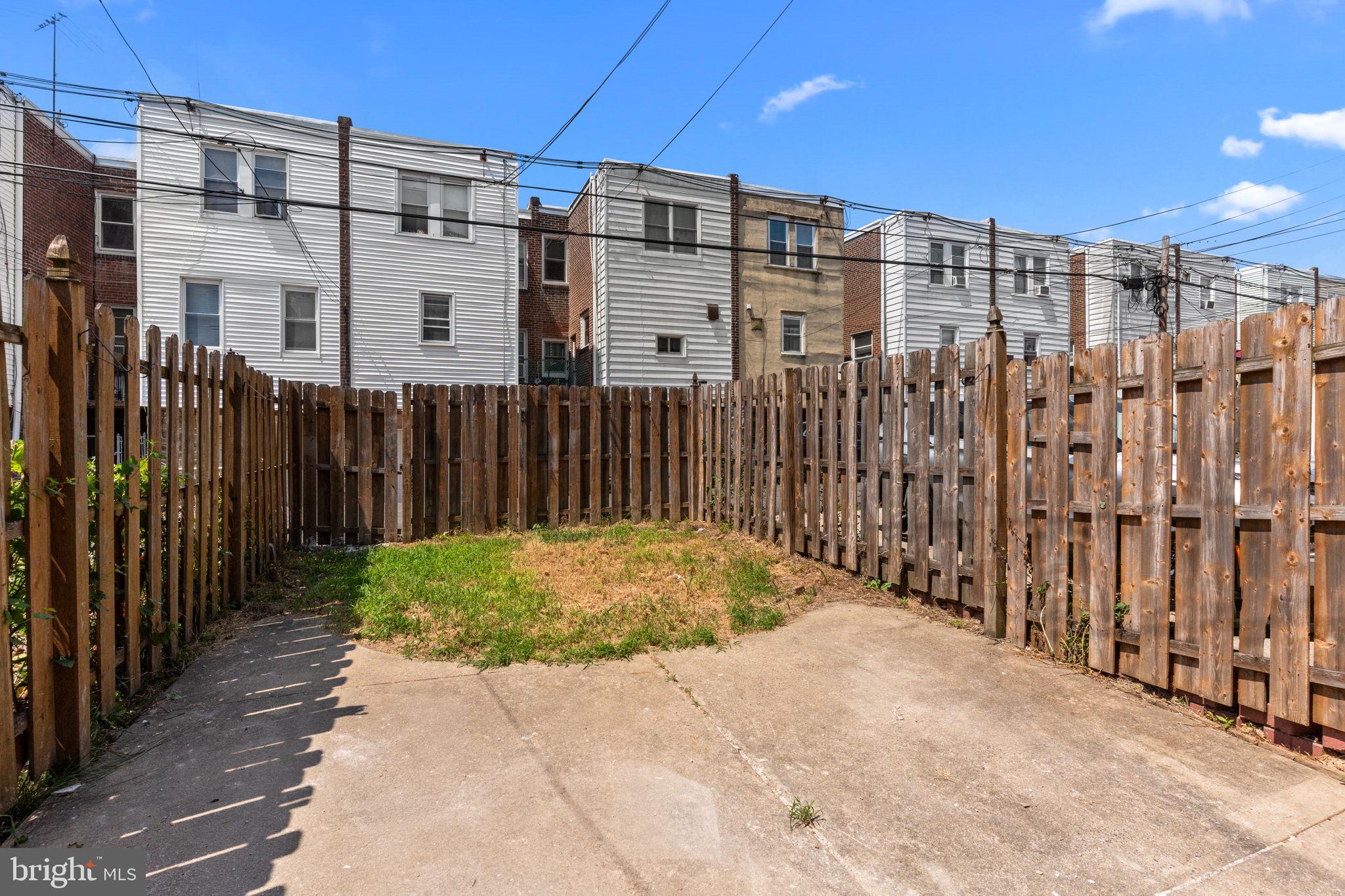 7122 Gillespie Street Philadelphia, PA 19135 - Photo 23 of 24 a view of a building with a backyard