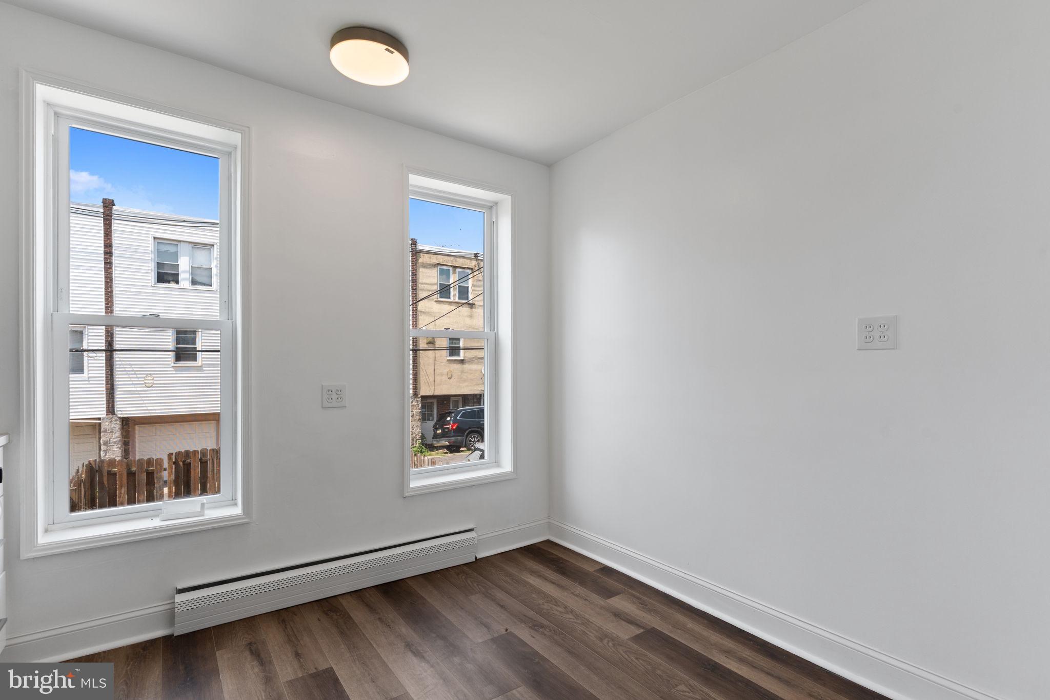 7122 Gillespie Street Philadelphia, PA 19135 - Photo 9 of 24 an empty room with windows