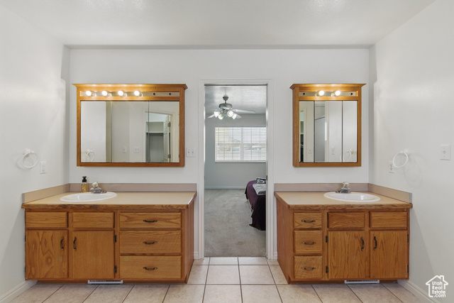 151 South Haulage Road Eureka, UT 84628 - Photo 18 of 36 Ensuite bathroom featuring two vanities, light tile patterned floors, and a ceiling fan