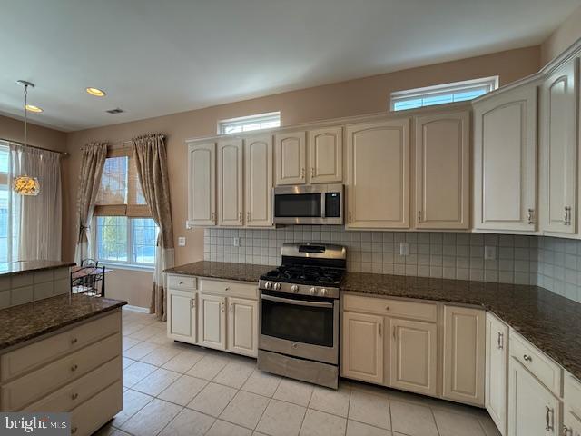 121 Einstein Way Cranbury, NJ 08512 - Photo 30 of 33 a kitchen with granite countertop white cabinets and stainless steel appliances