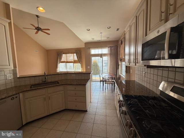 121 Einstein Way Cranbury, NJ 08512 - Photo 5 of 33 a kitchen with granite countertop a stove a sink and a microwave