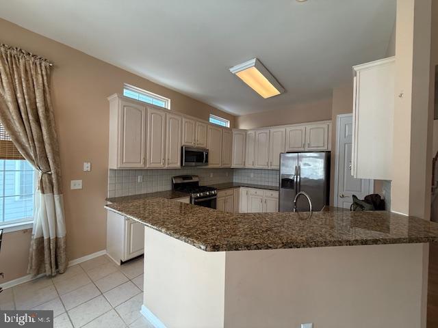 121 Einstein Way Cranbury, NJ 08512 - Photo 7 of 33 a kitchen with granite countertop a sink a stove and cabinets
