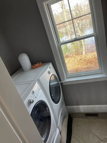 a utility room with dryer and washer