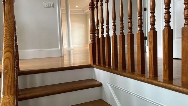 a view of a livingroom with wooden floor and a fireplace