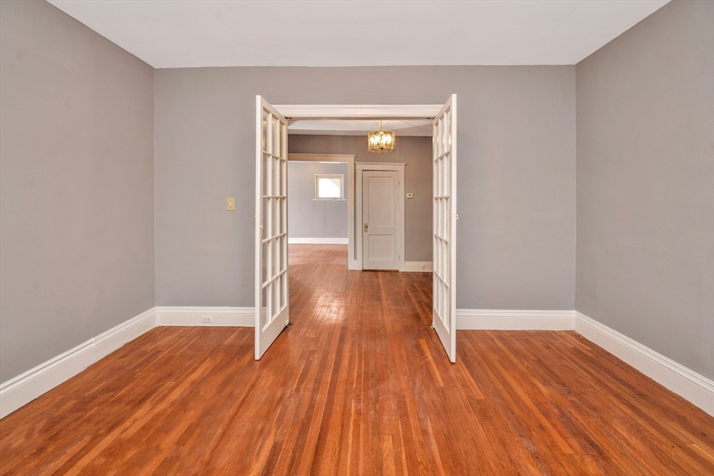 146 Homestead Street Boston, MA 02121 - Photo 36 of 40 wooden floor in an empty room