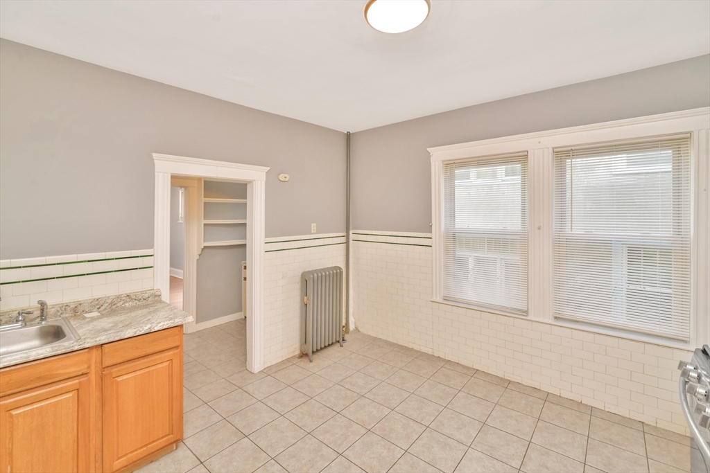 146 Homestead Street Boston, MA 02121 - Photo 7 of 40 a view of empty room with cabinet and mirrors