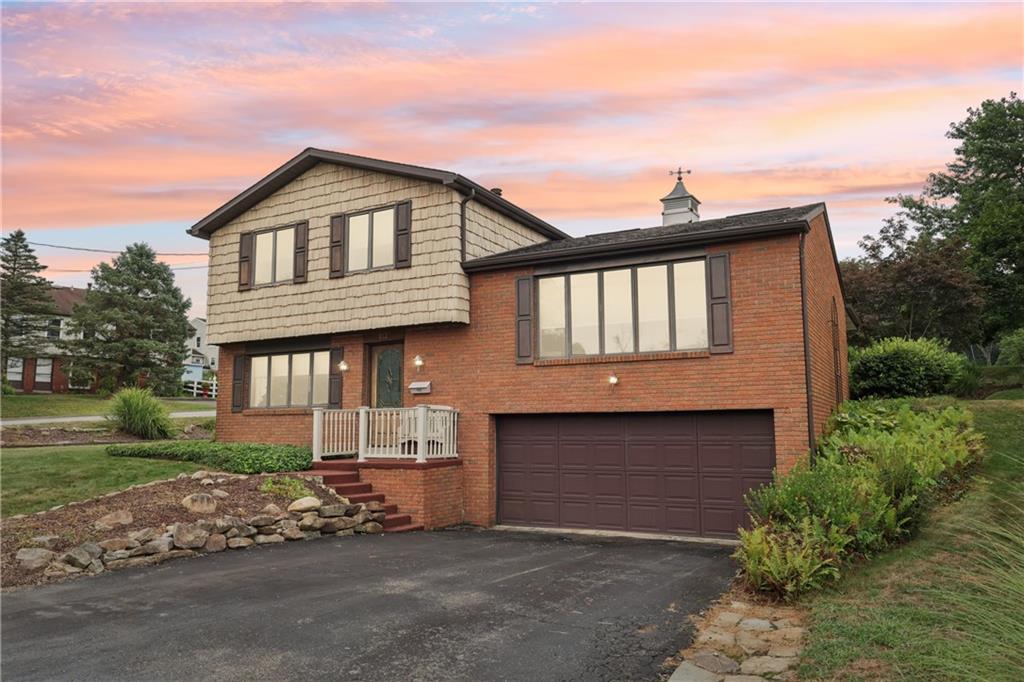 712 North 16th Street North Apollo, PA 15673 - Photo 2 of 25 a front view of a house with a yard and garage