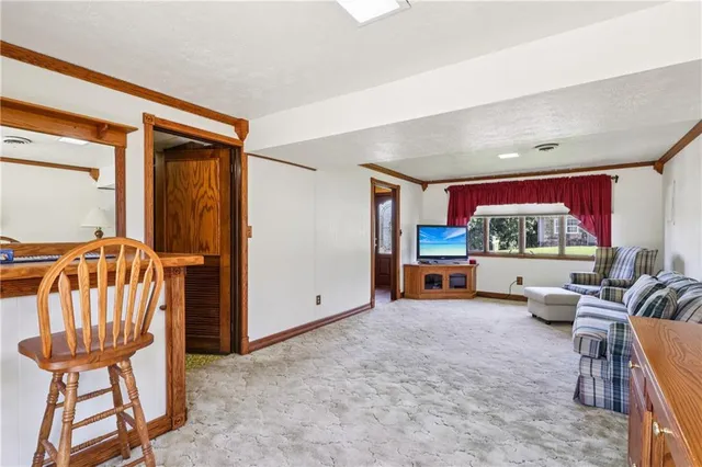 a living room with furniture and a area