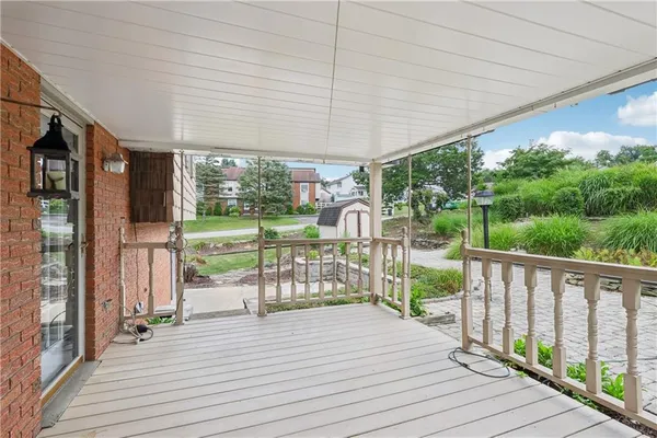 a view of a patio with wooden floor