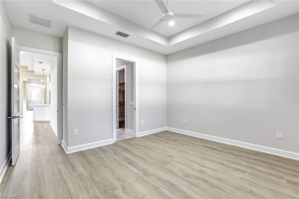 8921 Yucatan Court Naples, FL 34113 - Photo 6 of 20 wooden floor in an empty room
