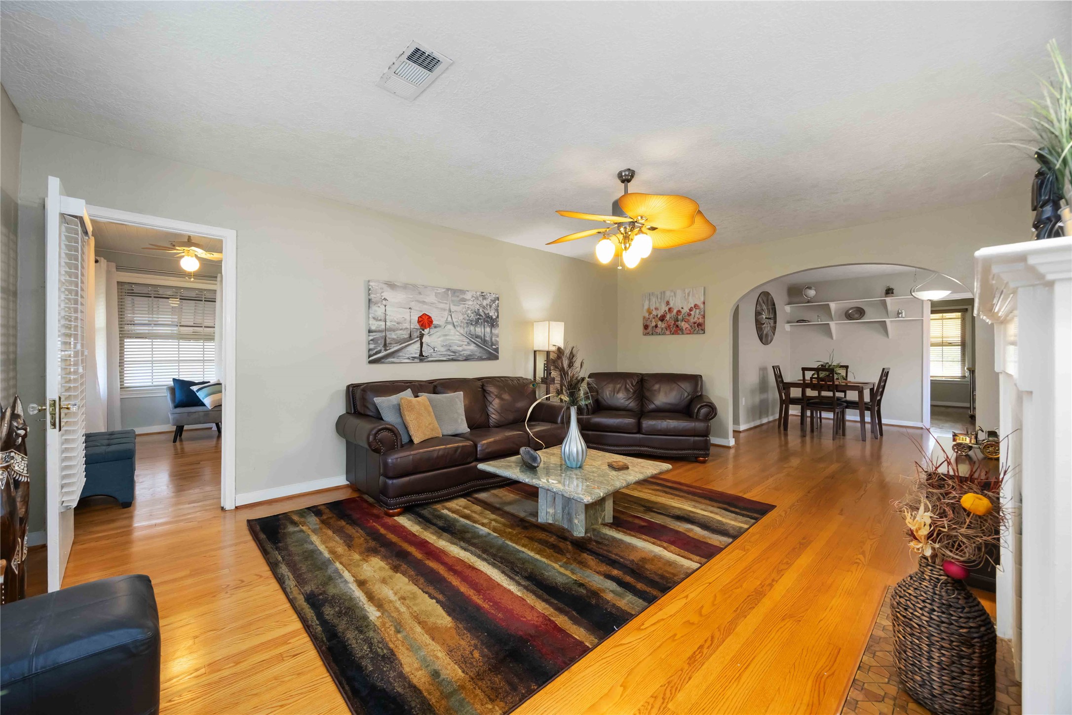 2104 Winbern Street Houston, TX 77004 - Photo 12 of 24 a living room with furniture and a chandelier