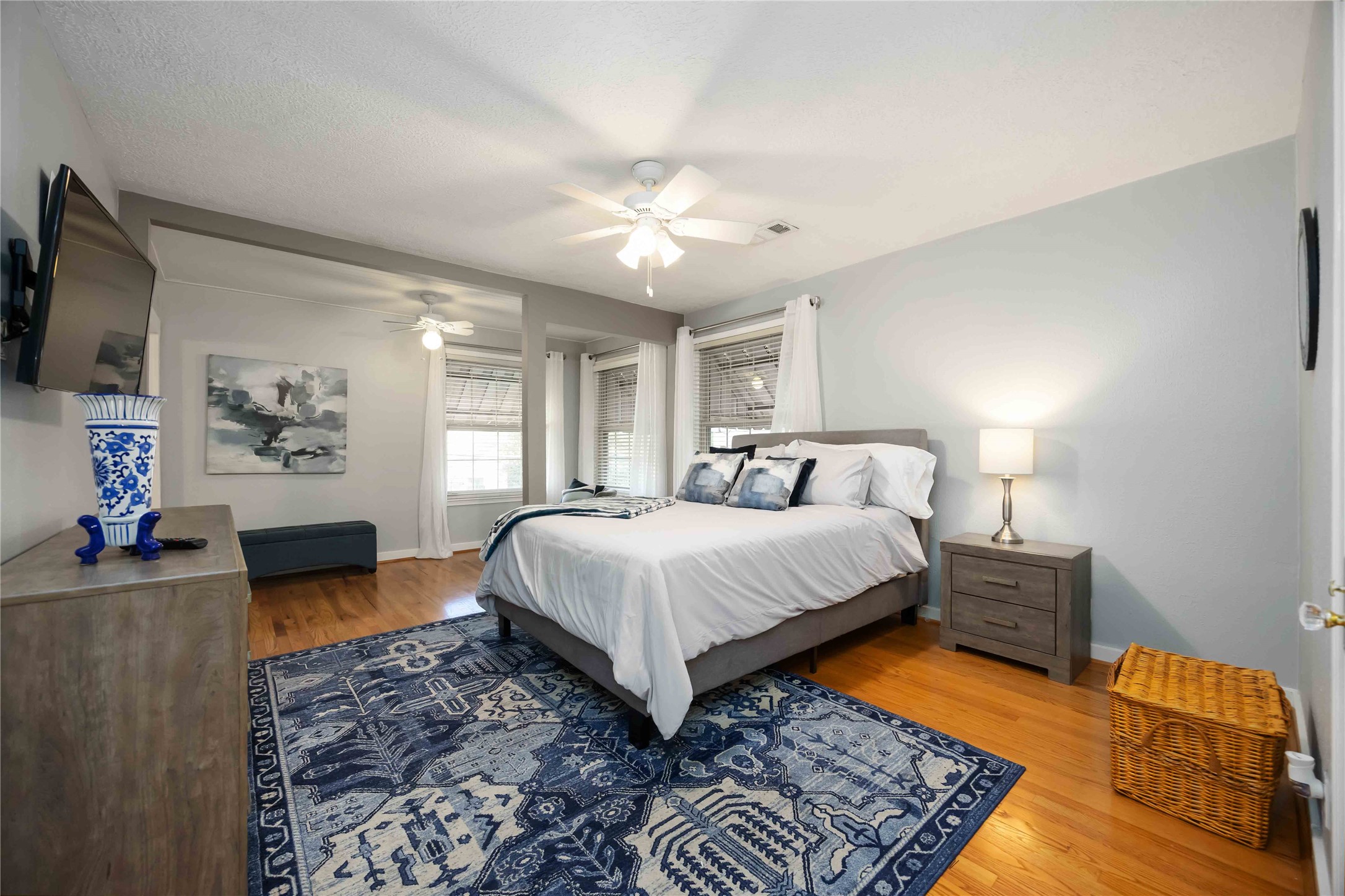 2104 Winbern Street Houston, TX 77004 - Photo 14 of 24 a spacious bedroom with a bed and a couch