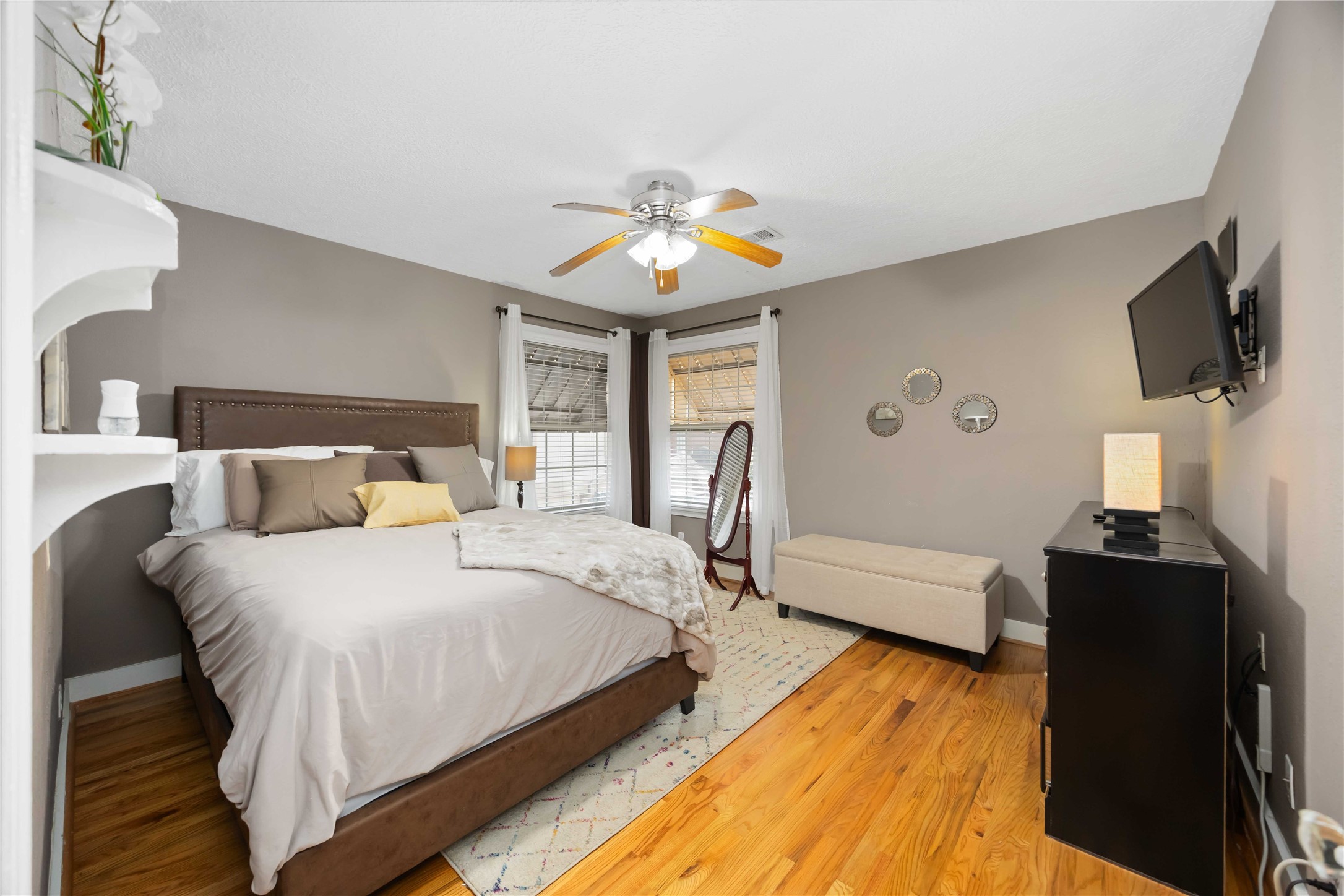 2104 Winbern Street Houston, TX 77004 - Photo 18 of 24 a bedroom with a bed and flat screen tv