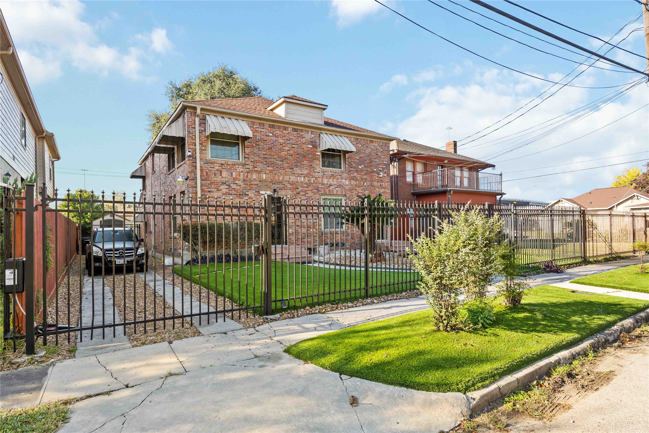 2104 Winbern Street Houston, TX 77004 - Photo 2 of 24 a front view of a house with a garden