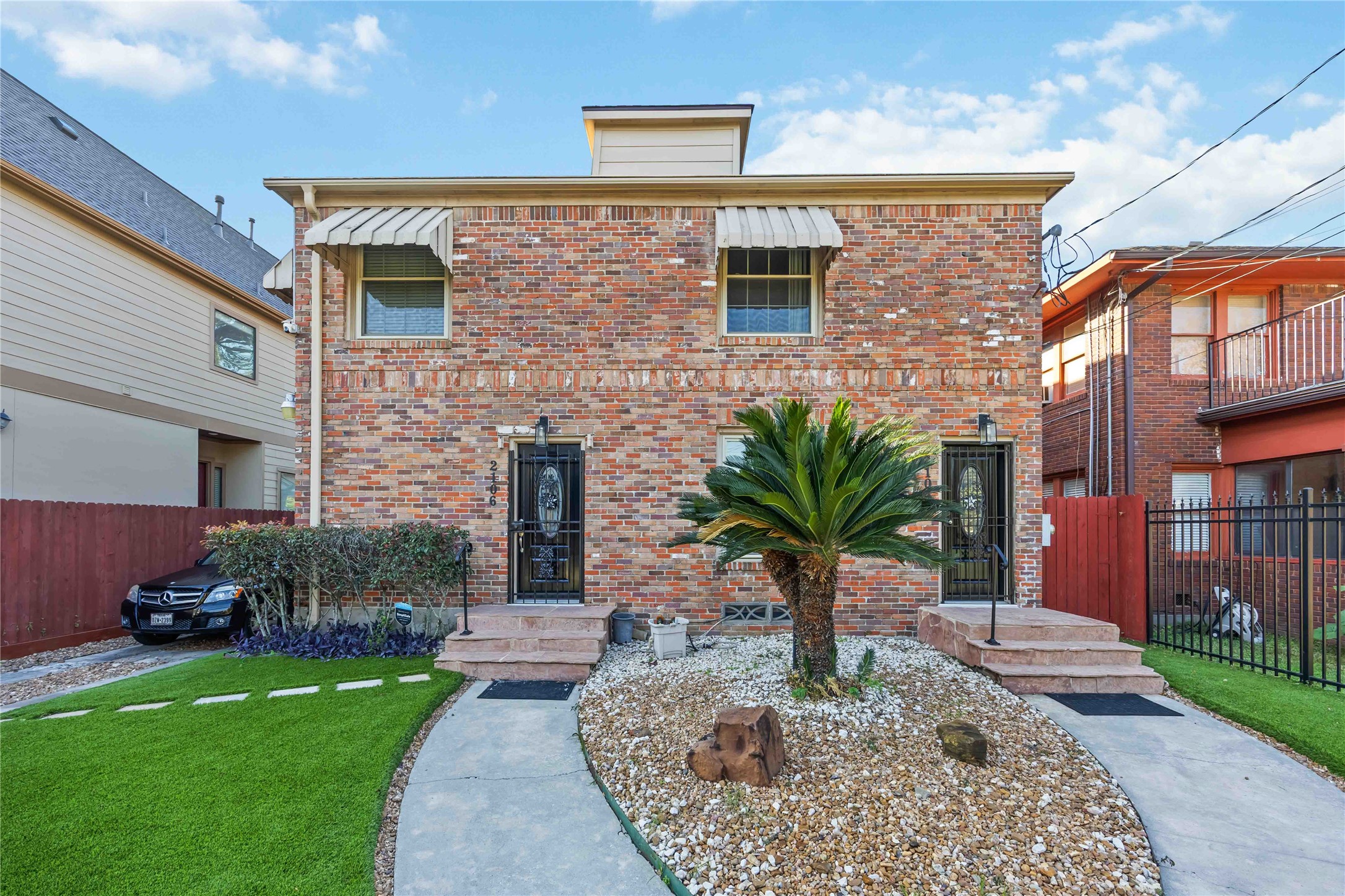 2104 Winbern Street Houston, TX 77004 - Photo 3 of 24 a front view of a house with garden