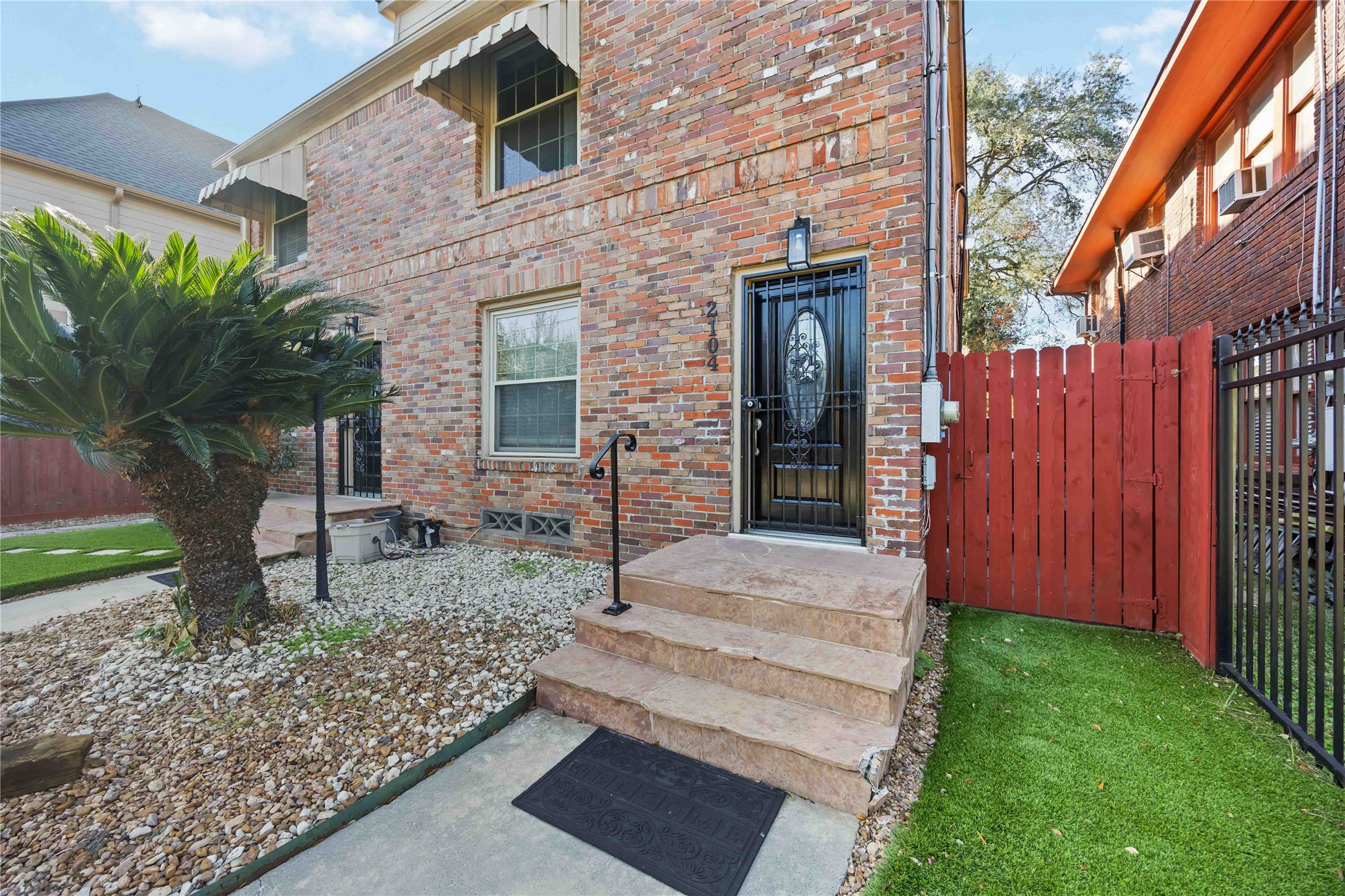 2104 Winbern Street Houston, TX 77004 - Photo 4 of 24 a front view of a house with garden