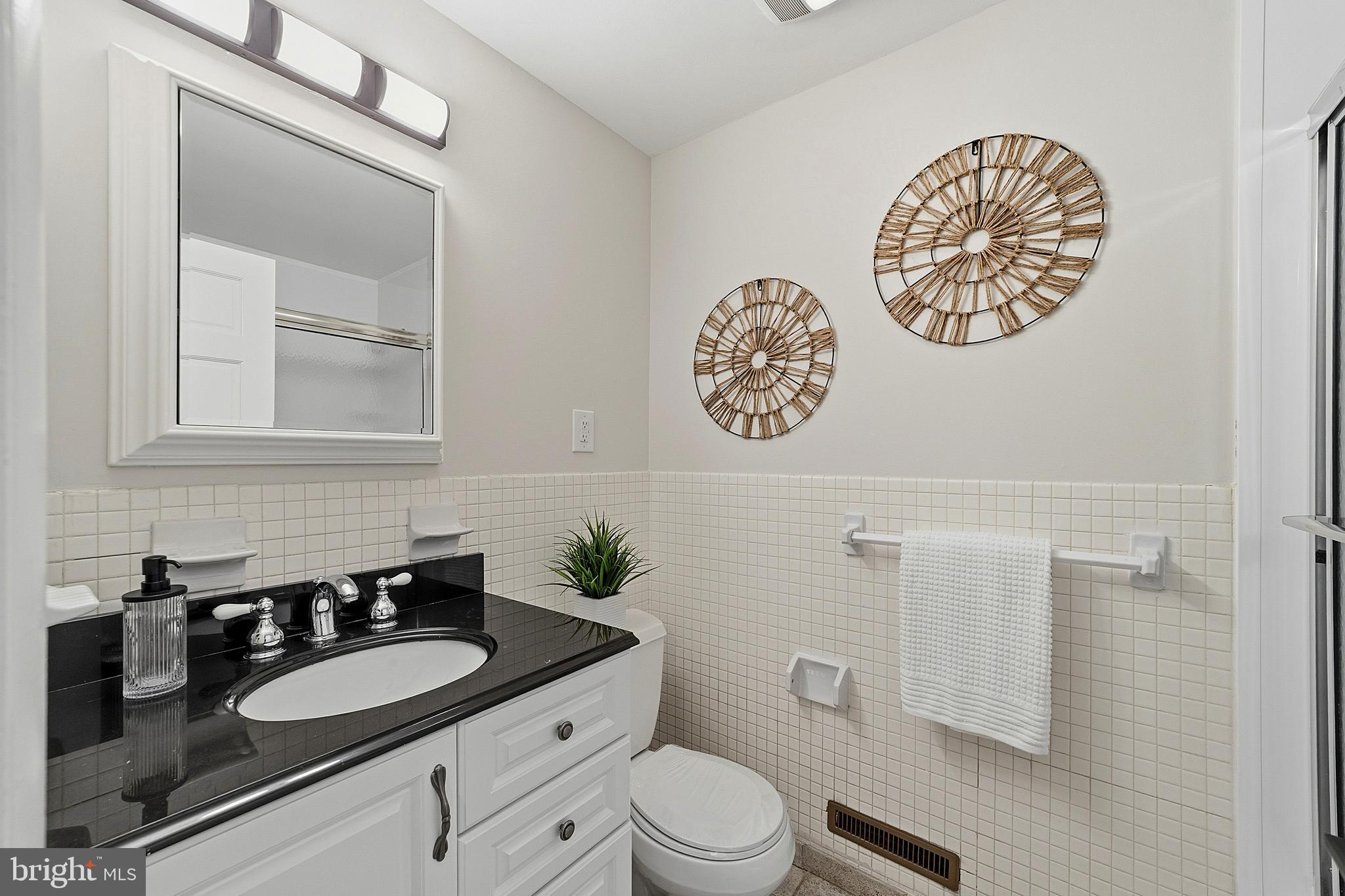 117 Harvest Road Cherry Hill, NJ 08002 - Photo 30 of 35 a bathroom with a granite countertop sink mirror vanity and toilet