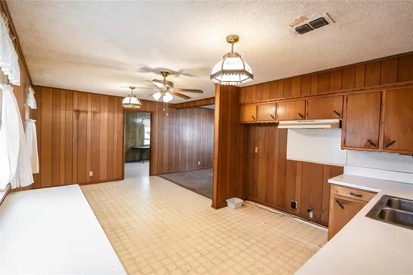 a view of a livingroom with a furniture and chandelier