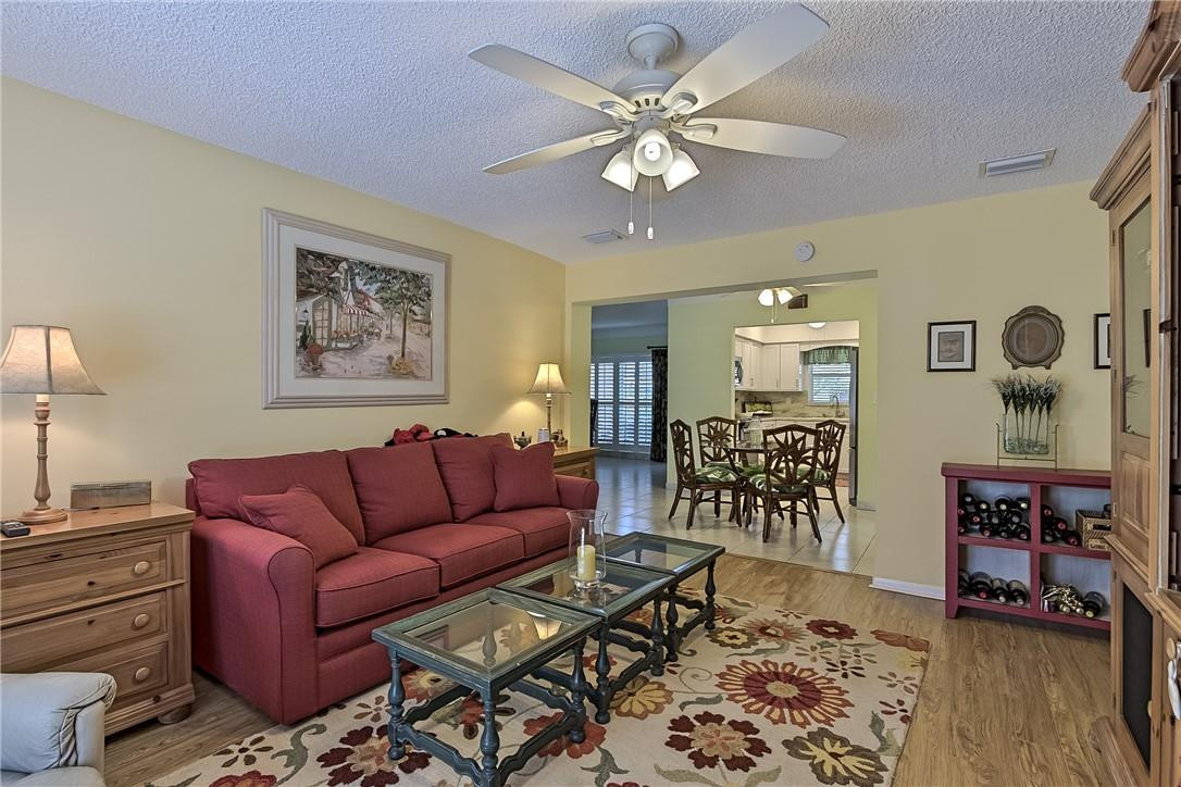 2265 Northeast 37th Court Lighthouse Point, FL 33064 - Photo 13 of 40 Family room with laminate wood flooring