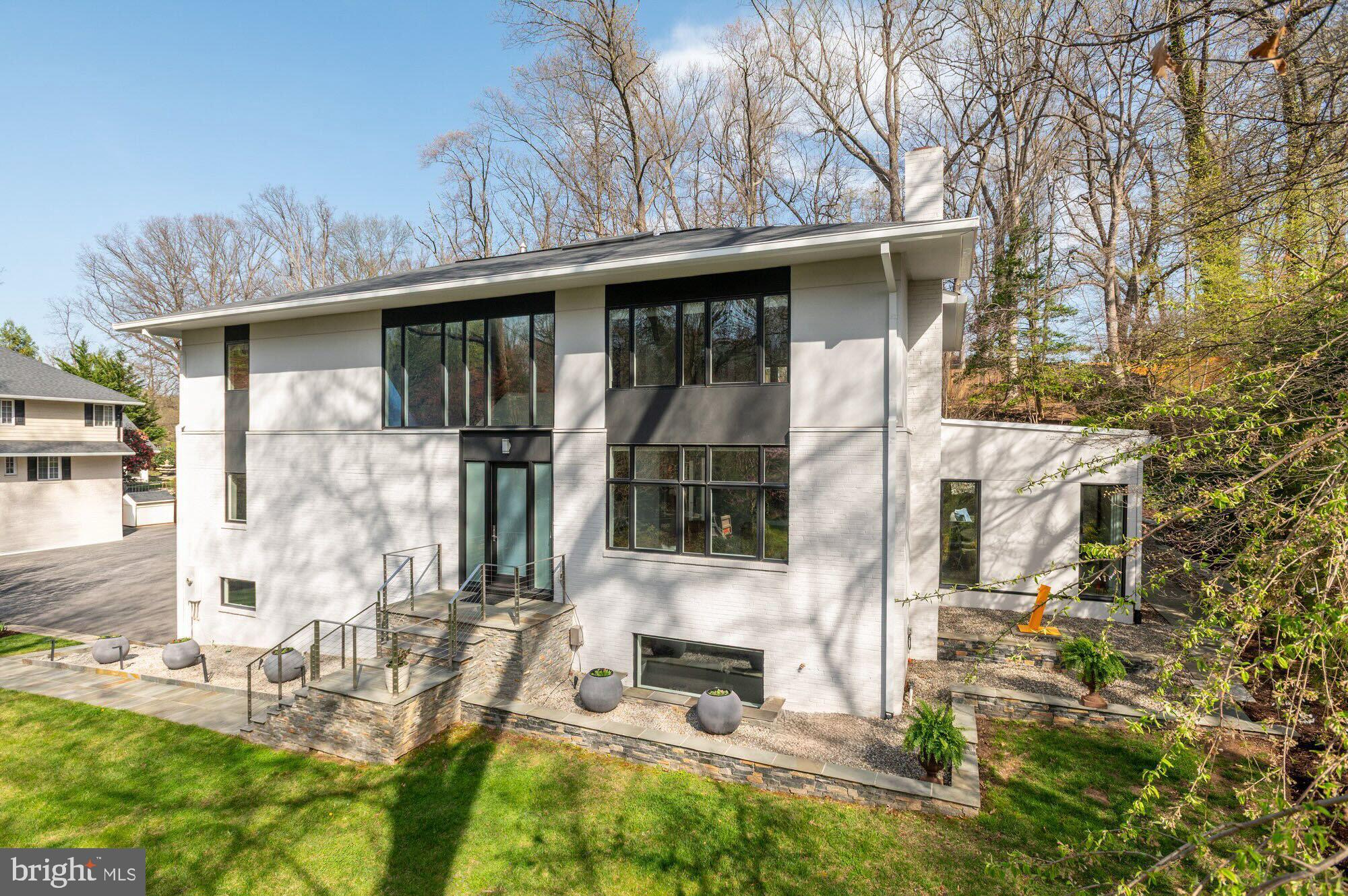 6016 Chesterbrook Road McLean, VA 22101 - Photo 2 of 67 a front view of a house with a yard