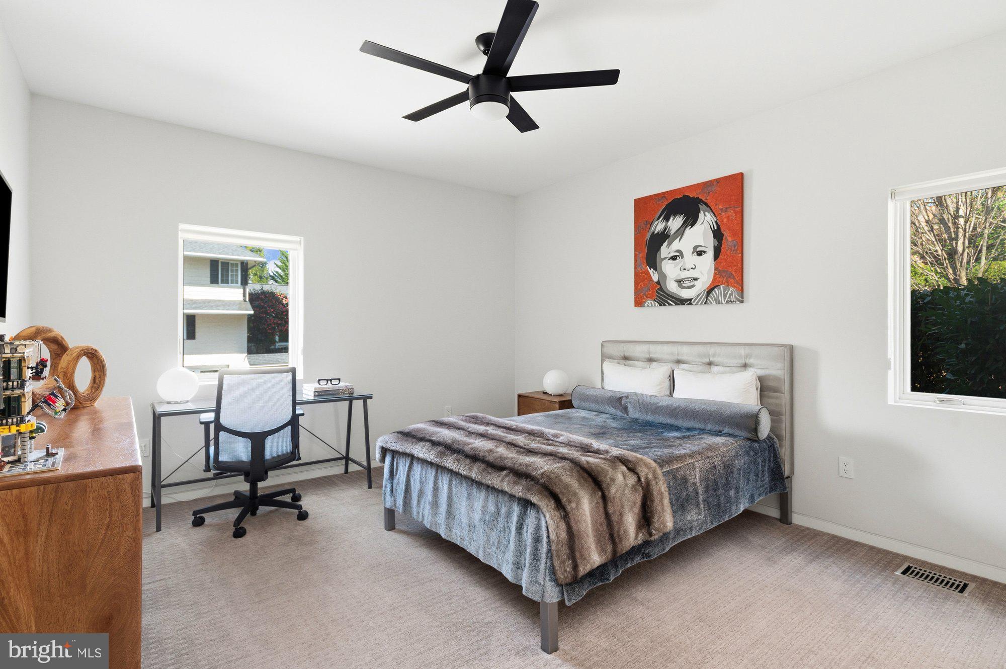 6016 Chesterbrook Road McLean, VA 22101 - Photo 21 of 67 a bedroom with a bed and furniture
