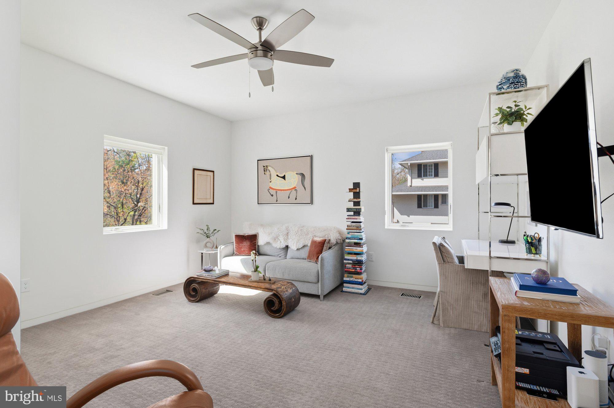 6016 Chesterbrook Road McLean, VA 22101 - Photo 25 of 67 a living room with furniture and a flat screen tv