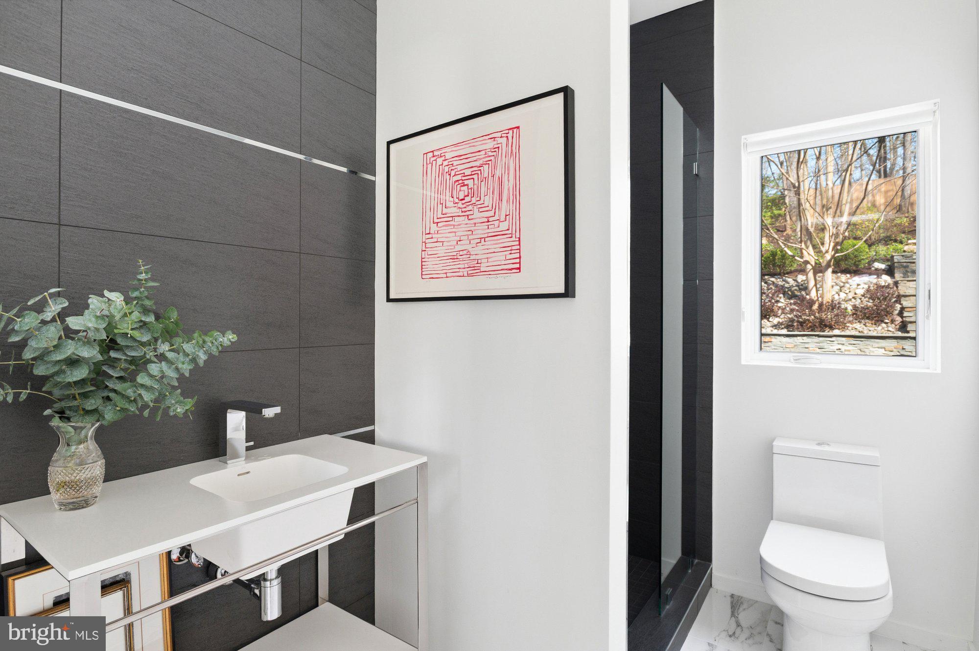 6016 Chesterbrook Road McLean, VA 22101 - Photo 26 of 67 a bathroom with a sink and a toilet