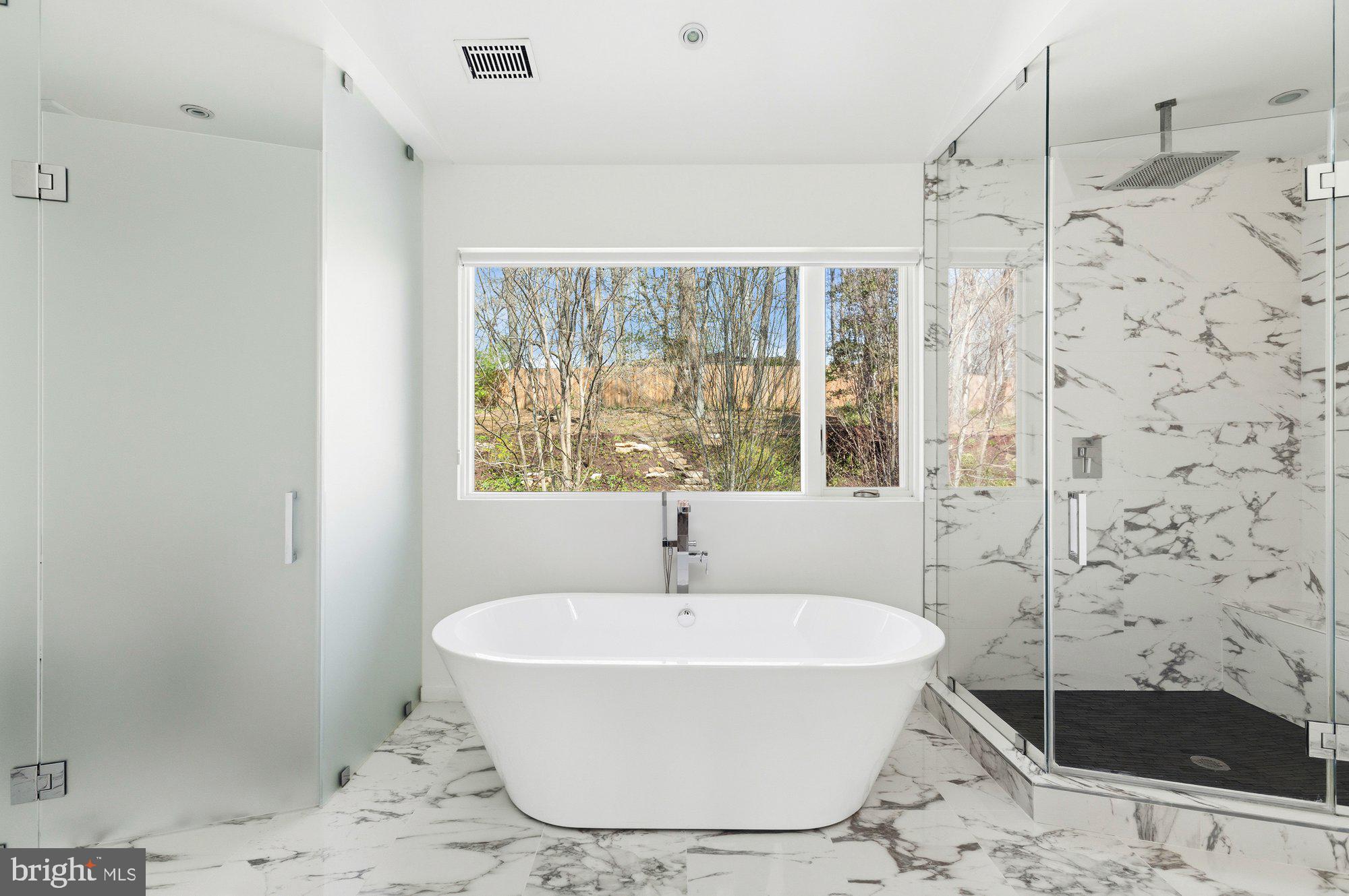 6016 Chesterbrook Road McLean, VA 22101 - Photo 33 of 67 a white bath tub sitting next to a shower
