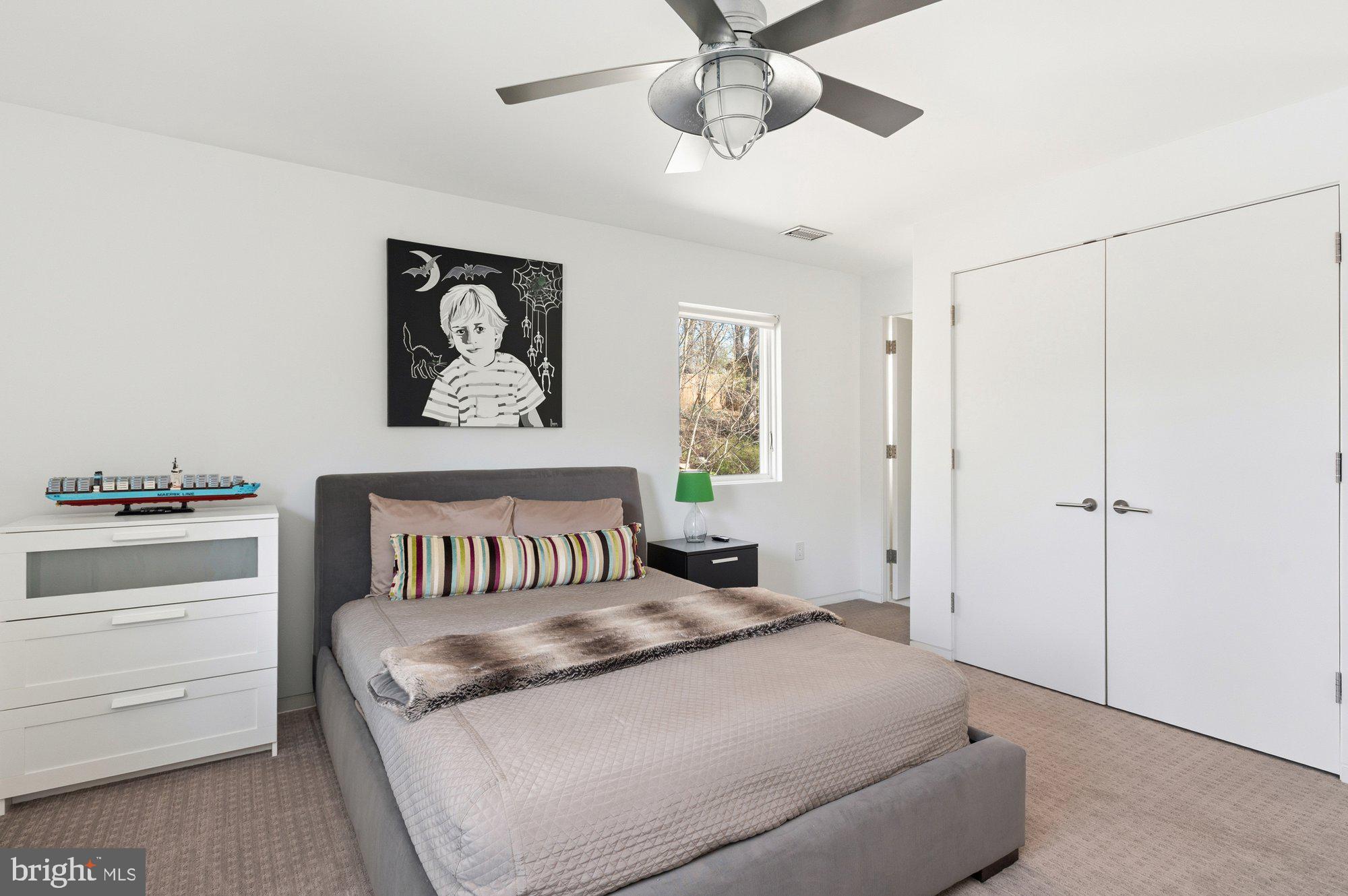 6016 Chesterbrook Road McLean, VA 22101 - Photo 41 of 67 a bedroom with a large bed and a chandelier