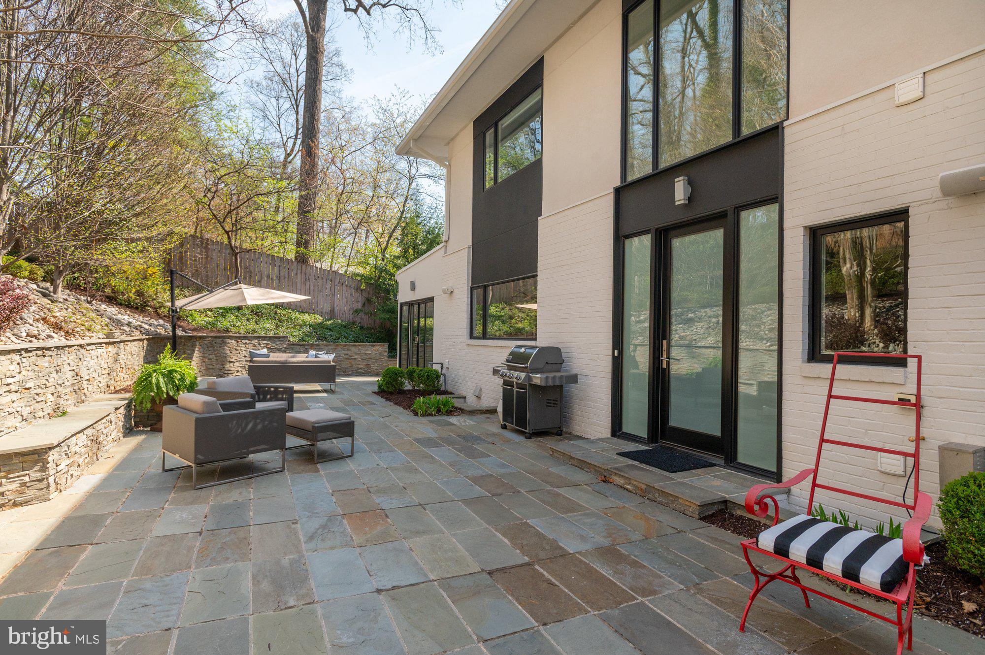 6016 Chesterbrook Road McLean, VA 22101 - Photo 55 of 67 a view of a patio with couple of chairs and a potted plant