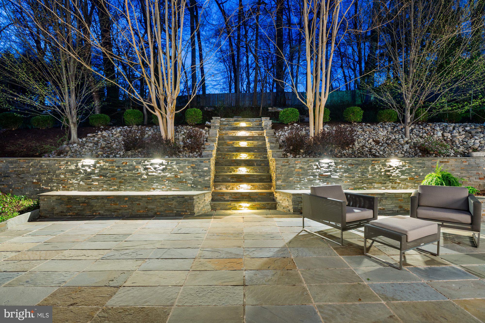 6016 Chesterbrook Road McLean, VA 22101 - Photo 58 of 67 a view of a chairs and tables in the back yard of the house