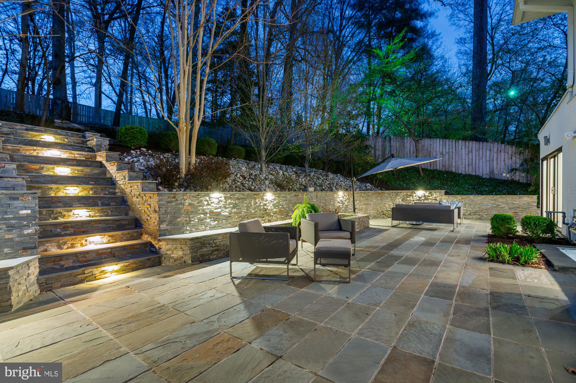 6016 Chesterbrook Road McLean, VA 22101 - Photo 60 of 67 a view of a patio with table and chairs potted plants and large tree