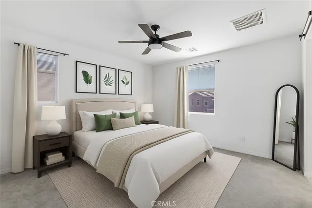 a bedroom with furniture and a window