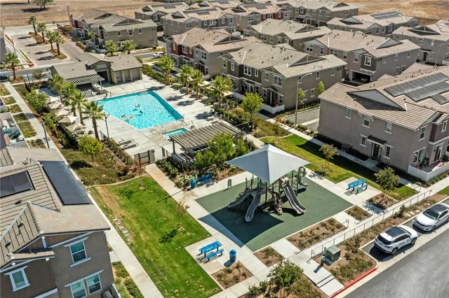 an aerial view of residential houses with outdoor space