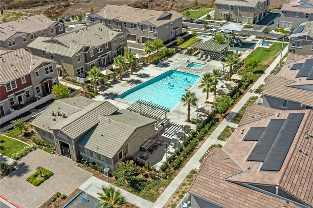 an aerial view of residential houses with outdoor space