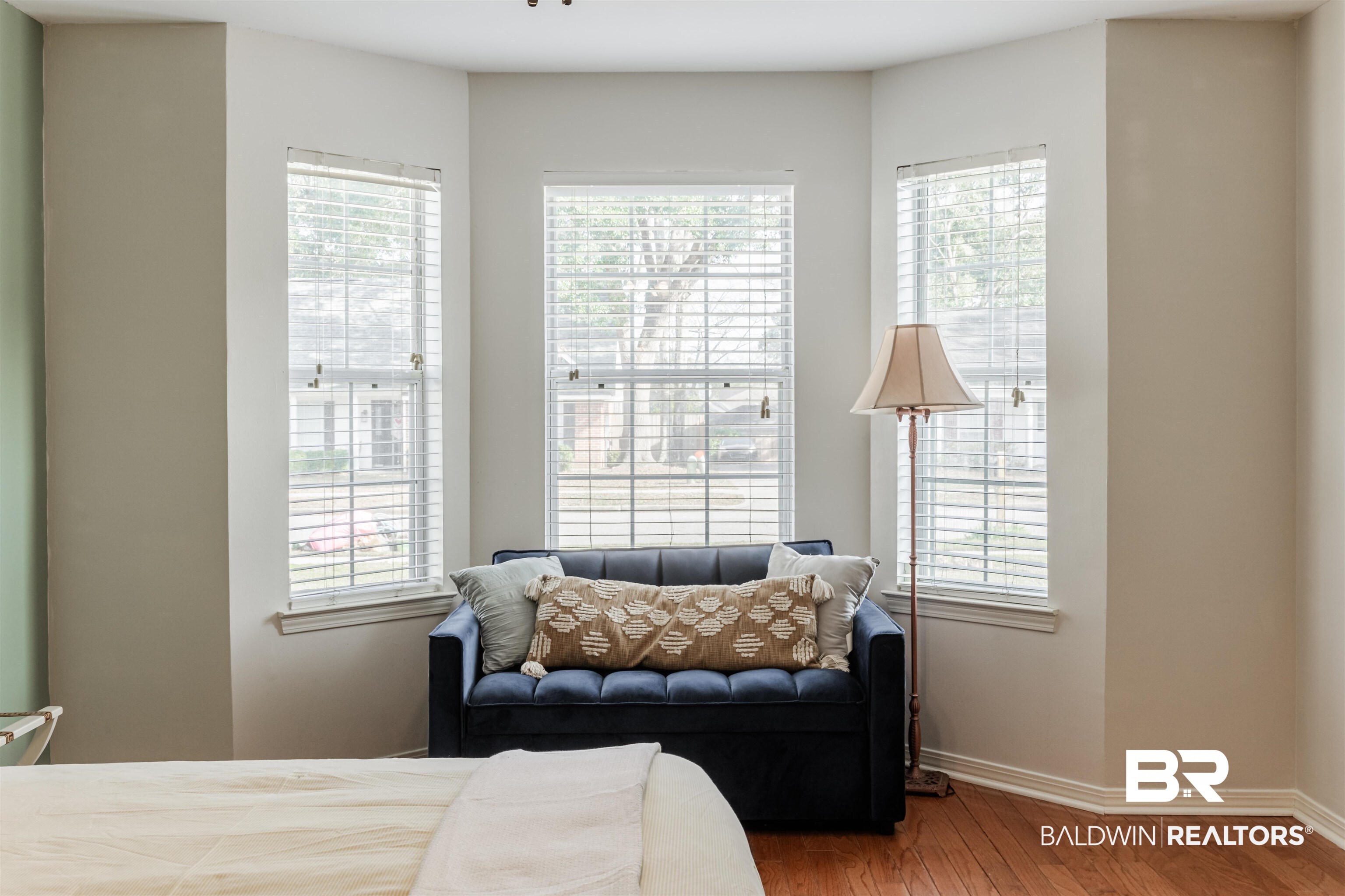 3844 Isabel Way South Mobile, AL 36693 - Photo 23 of 49 Bedroom featuring multiple windows and hardwood / wood-style flooring